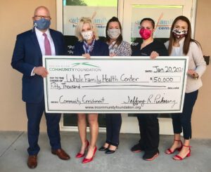 Whole Family Health Center. Photo ID: Jeff Pickering, CEO of Indian River Community Foundation, with Marie Andress, Carly Pye, Christina Martinez, and Sophia North of Whole Family Health Center.